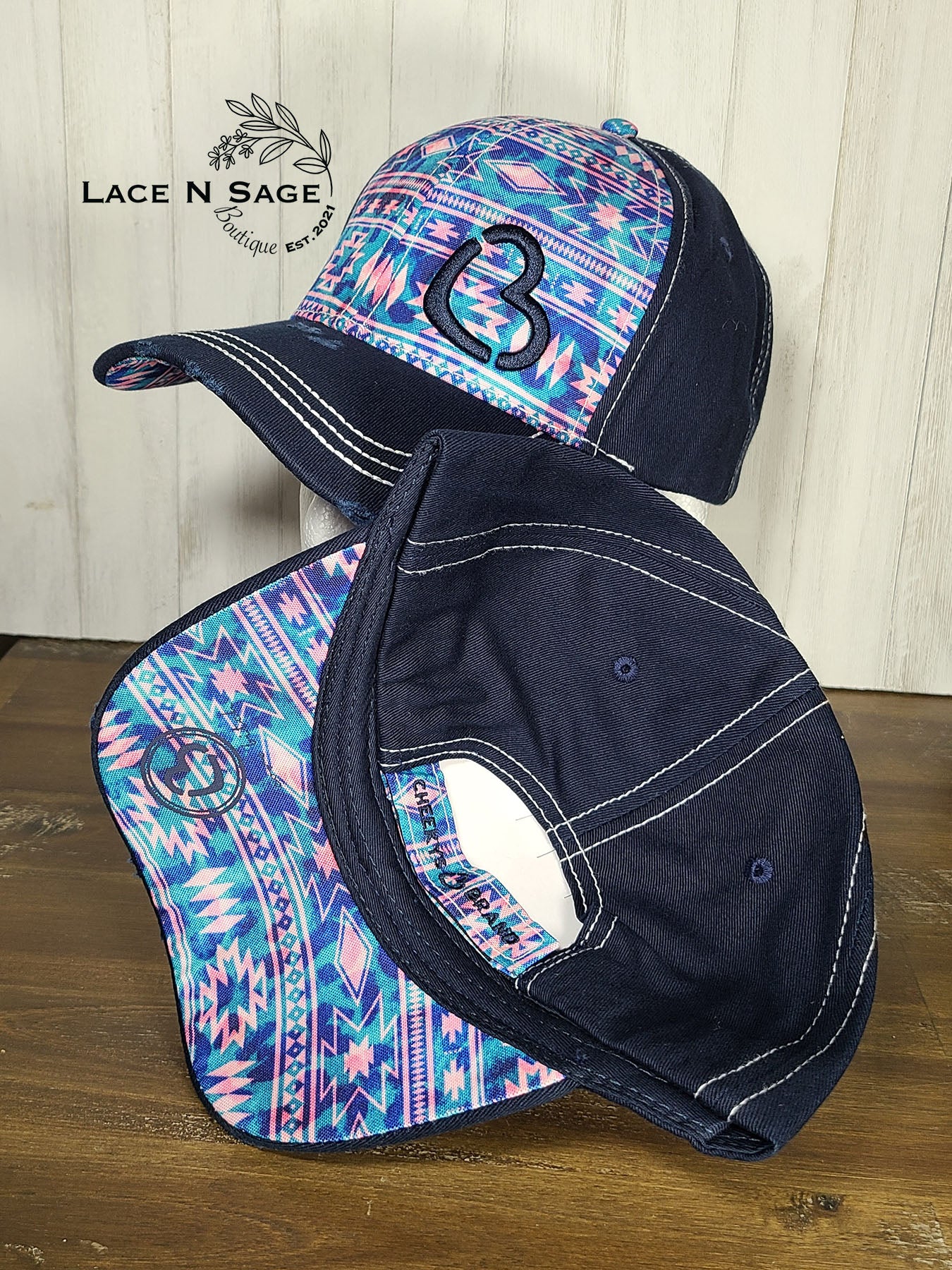 TURQUOISE AND PINK AZTEC BC ON A NAVY-BLUE CAP