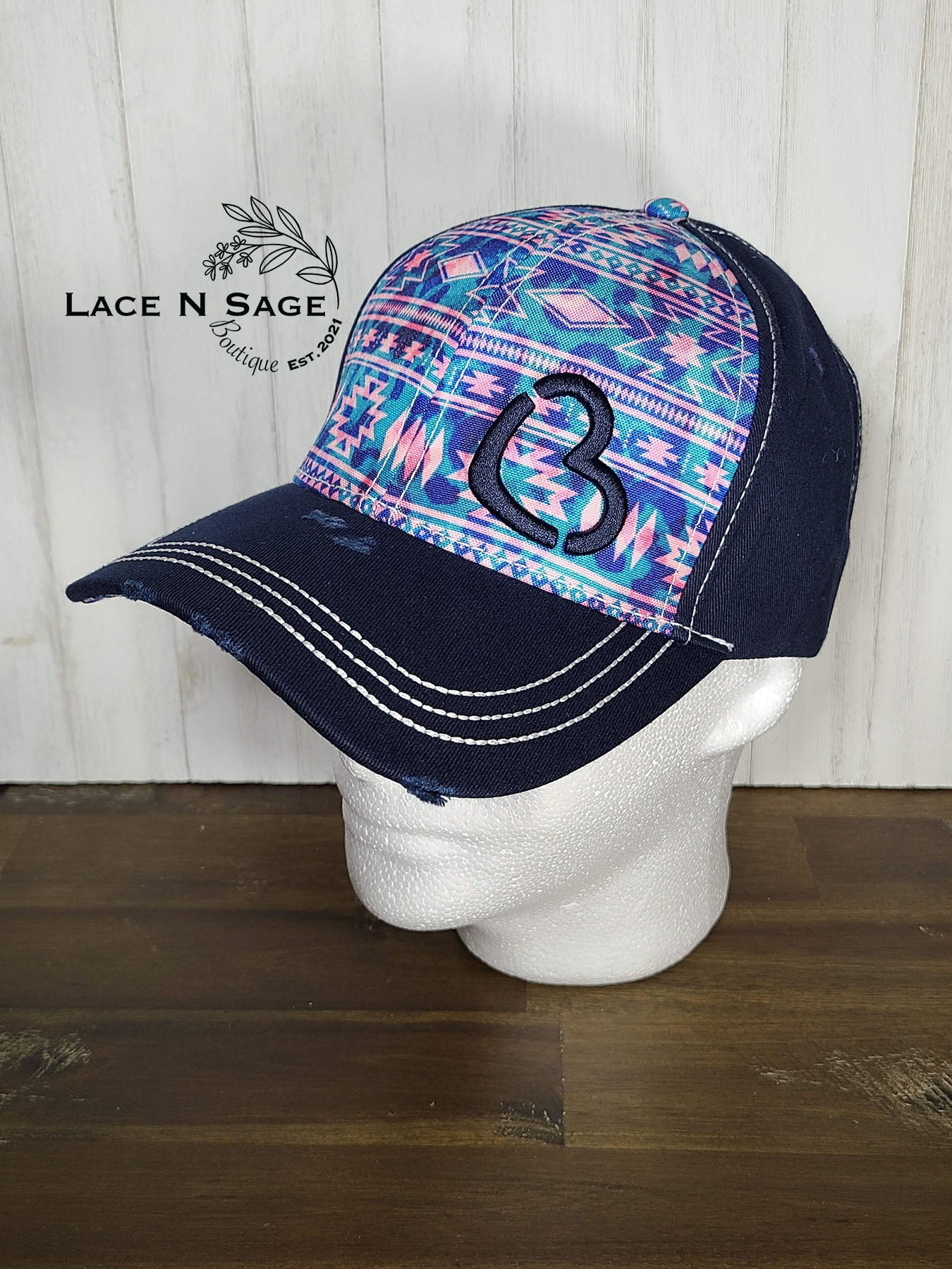 TURQUOISE AND PINK AZTEC BC ON A NAVY-BLUE CAP